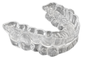 Closeup of a clear sleep apnea mouthguard from the front, right side.